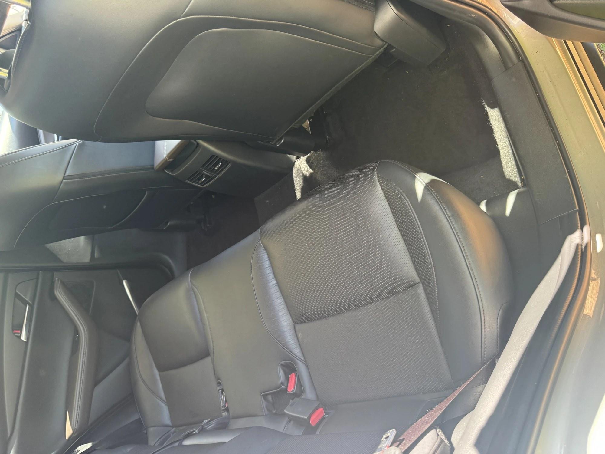 Crumbs and debris across the interior seats and carpet